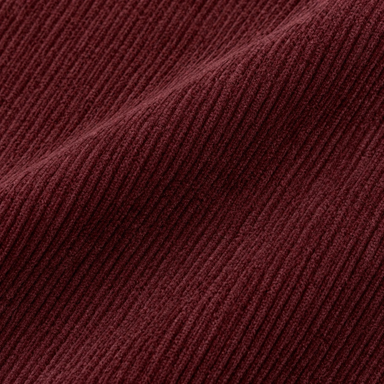 Close-up of the wine-red cotton corduroy of the Bicho Carpinteiro Overshirt